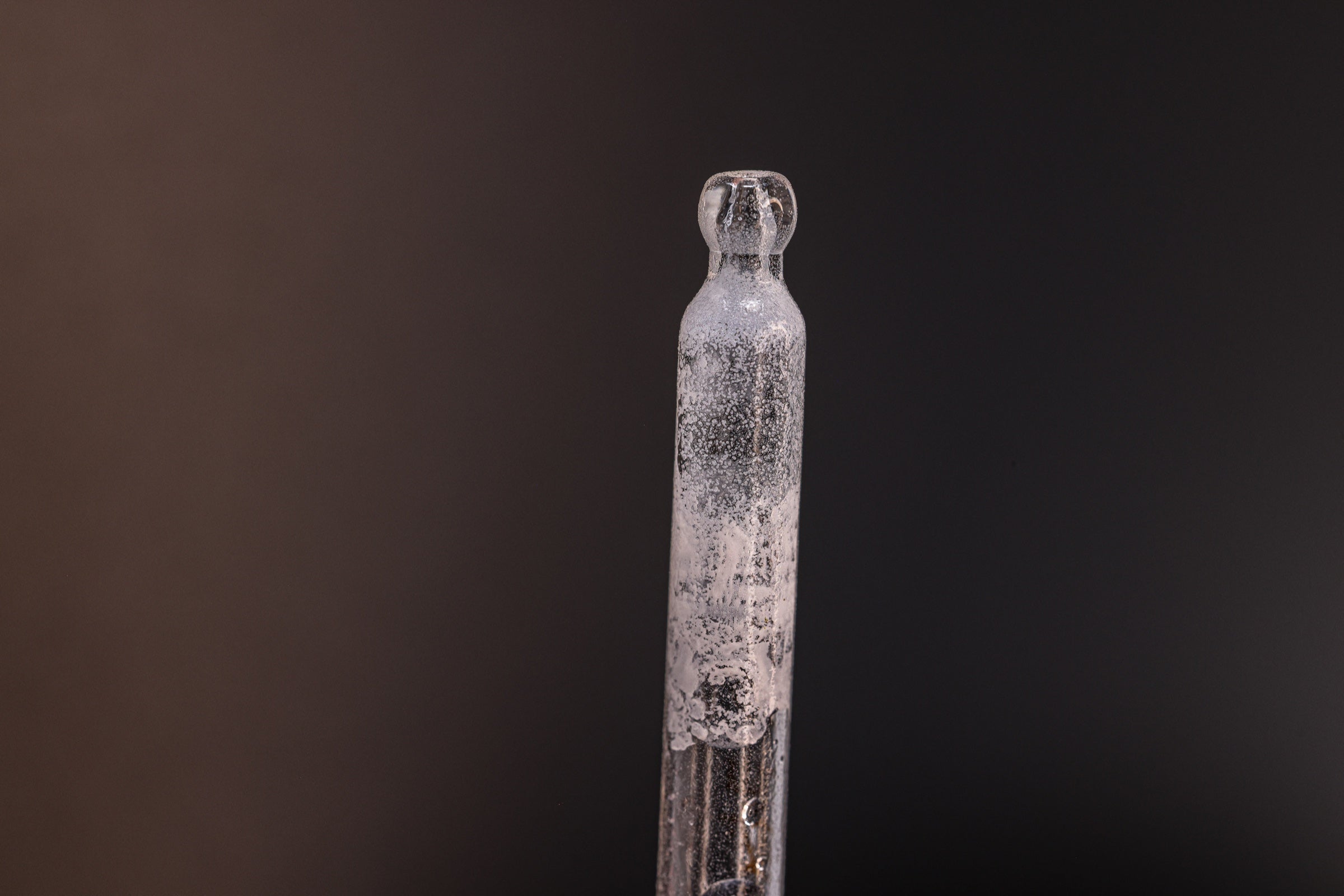Condensation and mineral residue inside an improperly stored bottle